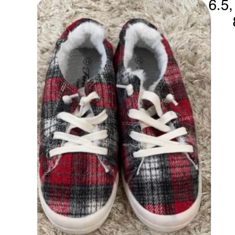 Red plaid slip on sneakers with fur inside.